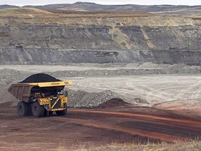 In this March 28, 2017, file photo, a dump truck hauls coal at Contura Energy's Eagle Butte Mine near Gillette, Wyo. The Alberta government is changing coal policies to make it easier to develop open-pit mines in one of the province's most sensitive areas.