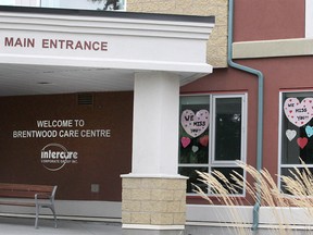 Signs are seen hanging in windows and outside the Intercare Brentwood Care Centre during the COVID-19 pandemic in Calgary. Tuesday, May 26, 2020.
