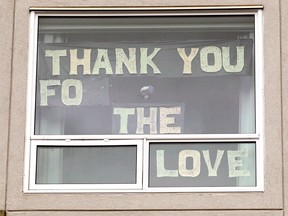 Signs are seen hanging in windows and outside the Intercare Brentwood Care Centre during the COVID-19 pandemic in Calgary. Tuesday, May 26, 2020.