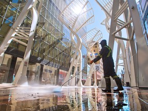 Stephen Avenue Mall gets a high pressure wash on Sunday, May 24, 2020. Calgary is set to allow more reopening tomorrow with hair stylists, barbers and sit down restaurants allowed to reopen with COVID-19 precautions.