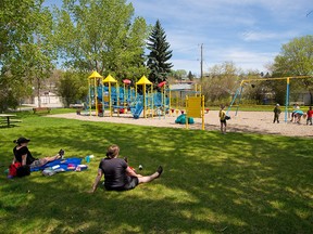 Kids played in the park adjacent to a closed playground in Bridgeland on Thursday, May 28, 2020. Closed over 2 months ago due to the COVID-19 pandemic playgrounds are expected to open again on Monday, June 1.