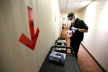 Nurse Keel Stewart prepares to deliver medicineat the assisted self isolation hotel in Calgary on Thursday, May 7, 2020. Postmedia has agreed not to reveal the exact location of the hotel. Jim Wells/Postmedia