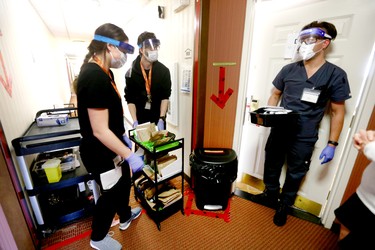 Nurses prepare to deliver medicine, food and some clean clothing at the assisted self isolation hotel in Calgary on Thursday, May 7, 2020. Postmedia has agreed not to reveal the exact location of the hotel. Jim Wells/Postmedia