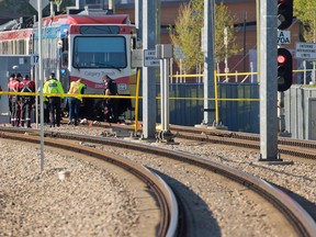 CPS traffic unit investigators inspect the scene at the Somerset-Bridlewood station after a man was struck and killed by a CTrain early Tuesday morning.