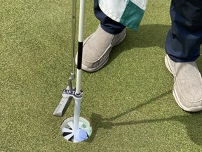 Several Calgary-area courses are using The Cup Caddie — a contactless contraption to retrieve your ball from the hole — to help prevent the spread of COVID-19. Supplied photo