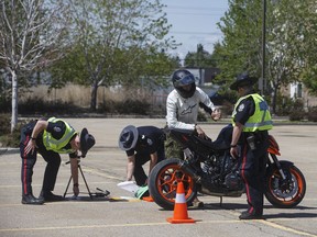 Police test the noise level on motorbikes during the COVID-19 pandemic, in Edmonton on Thursday, May 28, 2020. With less traffic on the roads there has been an increase in speeding and noisy vehicles on the streets.