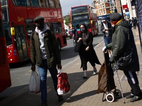General view of people in Tooting wearing face masks, following the outbreak of the coronavirus disease (COVID-19), London, Britain, May 4, 2020.
