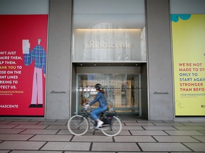 A cyclist drives past La Rinascente department store, which is due to reopen with social distancing measures applied, after it was closed due to the spread of the coronavirus disease (COVID-19) in Milan, Italy, May 16, 2020.