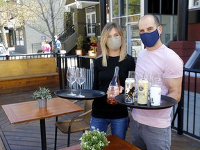Wine Bar Kensington and Container Bar owners, Cam Dobranski and wife, Jacq Warrell get ready to open up this week in Calgary on Sunday, May 24, 2020. Darren Makowichuk/Postmedia
