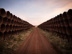 FIle photo of unused pipe, prepared for the proposed Keystone XL pipeline, sit in a lot on Oct. 14, 2014 outside Gascoyne, North Dakota.