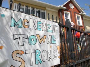 Signs and flowers are seen hanging outside the McKenzie Towne Continuing Care Centre during the COVID-19 pandemic. Friday, May 15, 2020.