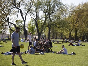 People gather at a park in Montreal, Quebec, Canada, on Wednesday, May 20, 2020.