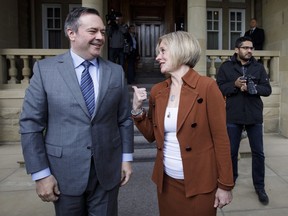 Premier-designate Jason Kenney and Alberta Premier Rachel Notley meet in Edmonton on Thursday, April 18, 2019. Alberta's opposition is demanding Premier Kenney return federal COVID-19 bailout money earmarked for his party, mocking Kenney by labelling Prime Minister Justin Trudeau the UCP's new "sugar daddy."