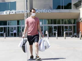 Dillan Witt walks out of CF Chinook Centre as Stage 1 of Alberta's relaunch plan came into effect in Calgary on Thursday, May 14, 2020.