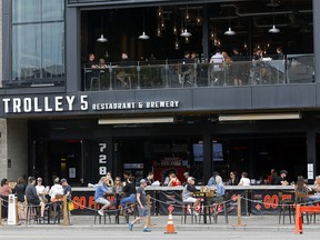 A busy day at Trolley 5 Restaurant and Brewery as business opened up in Calgary on Monday, May 25, 2020.