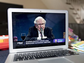 Warren Buffet, chairman and chief executive officer of Berkshire Hathaway Inc., speaks during the virtual Berkshire Hathaway annual shareholders meeting seen on a laptop computer in Arlington, Virginia, U.S., on Saturday, May 2, 2020.