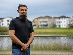 Khalil Karbani, spokesperson for the action committee lobbying the government to declare the recent hail storm a natural disaster, poses for a photo in his backyard in the community of Taradale on Tuesday, June 23, 2020.