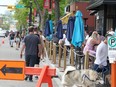 Restaurants along 17th Avenue S.W. in Calgary are sitting customers in the sidewalk as one lane on both sides of the street is closed in limited sections to allow more physical distancing during the COVID-19 pandemic. Brendan Miller/Postmedia