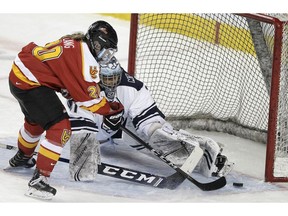 The Calgary Dinos' Elizabeth Lang scores a goal on Mount Royal University goaltender Cassie Shokar during the Crowchild Classic at the Saddledome on Thursday, Jan. 30, 2020. Brendan Miller/Postmedia