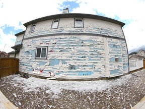 Hail stripped the siding from this home in northeast Calgary on Saturday, June 13, 2020.