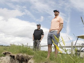 Rick Heenan, CGA President, and Reef Caulder, vice president of the CGA, pose for a photo near a cliff on the edge of the seventh hole at River's Edge Golf Club near Okotoks. On Friday Caulder traversed the cliff to save a boy in distress who was caught on a rock in the Sheep River. Calder pulled the boy to the shore as first responders arrived.