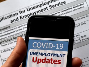 In this illustration file photo taken on May 8, 2020, a COVID-19 Unemployment Assistance Updates logo is displayed on a smartphone. It's time to rethink the nature of employment in the wake of the pandemic, says columnist Lee Stevens.