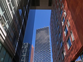 The Telus Sky building is framed by the St. Germain building in downtown Calgary on Thursday, June 11, 2020.