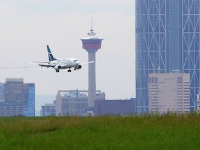 A WestJet flight from Vancouver lands at the Calgary International Airport on Wednesday, June 24, 2020.