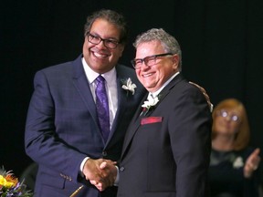 Mayor Naheed Nenshi, left, with Shane Keating as he is sworn in after the 2017 municipal election.