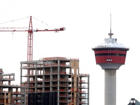 Several construction cranes are seen along the Calgary skyline. Monday, June 29, 2020.