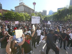 Protestors gather at Olympic Plaza in downtown Calgary on Wednesday, June 3, 2020. A large group marched through the downtown core and gathered at City Hall and Olympic Plaza for a candlelight vigil.