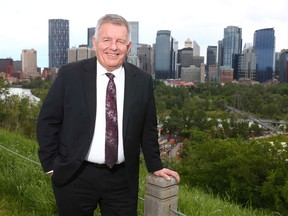 Brian Hahn, Chief Executive Officer of BILD, Calgary Region, poses with the view of downtown Calgary on Friday, June 19, 2020.