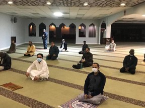 Muslims practice social distancing at MAC Rahma Masjid Mosque in Edmonton.