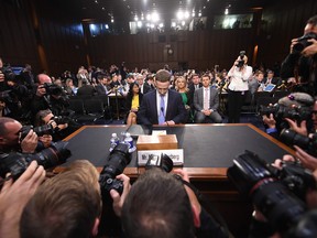 Facebook CEO Mark Zuckerberg arrives to testify before a joint hearing of the U.S. Senate Commerce, Science and Transportation Committee and Senate Judiciary Committee on Capitol Hill, April 10, 2018, in Washington, D.C.