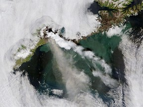 Okmok volcano, in Alaska's Aleutian Islands, released a continuous plume of ash and steam in early July 2008.