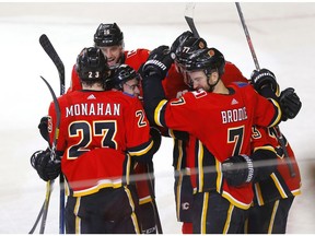 Calgary Flames T. J. Brodie scores the OT game winner on Columbus Blue Jackets goalie Joonas Korpisalo in NHL action at the Scotiabank Saddledome in Calgary on Wednesday, March 4, 2020. Darren Makowichuk/Postmedia