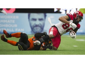 VANCOUVER. November 02 2019. BC Lions #32 Branden Dozier brings down Calgary Stampeders #80 Aaron Peck in a regular season CFL football game at BC Place, Vancouver, November 02 2019. Gerry Kahrmann / PNG staff photo) 00059263A [PNG Merlin Archive] ORG XMIT: POS1911022229205181