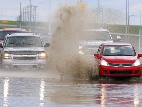 Thunderstorms hit the city again flooding intersections like 114th and 60str. S.E. in Calgary on Sunday, June 21, 2020.
