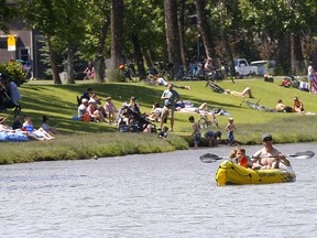 Calgarians enjoy the sun on the Elbow River at Stanley Park in Calgary on Saturday, June 20, 2020.