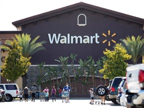 Shopper wearing face masks are pictured in the parking of a Walmart Superstore during the outbreak of the coronavirus disease (COVID-19), in Rosemead, California, U.S., June 11, 2020.