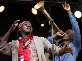 Jonas Attis (left) and Peterson Joseph of Lakou Mizik perform on the main stage during the Edmonton Folk Music Festival at Gallagher Park in Edmonton on Thursday, August 10, 2017. Ian Kucerak / Postmedia