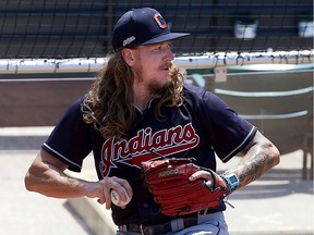 CLEVELAND, OHIO - JULY 03: In this handout image provided by the Cleveland Indians, Mike Clevinger #52 of the Cleveland Indians throws during a summer workout in preparation for a shortened MLB season due to the coronavirus (COVID-19) pandemic at Progressive Field on July 03, 2020 in Cleveland, Ohio.