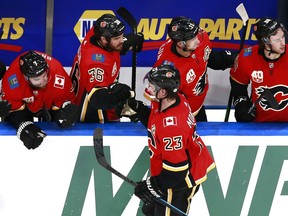 EDMONTON, ALBERTA - JULY 28: Sean Monahan #23 of the Calgary Flames celebrates with his teammates after Elias Lindholm #28 scored a goal on Mike Smith #41 of the Edmonton Oilers during the second period in an exhibition game prior to the 2020 NHL Stanley Cup Playoffs at Rogers Place on July 28, 2020 in Edmonton, Alberta, Canada.