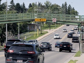 The city is planning to remove the pedestrian bridge over 14th Street N.W. in Hillhurst and replace it with a crosswalk.