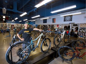 Pedalhead/Ski Works employee Manrique Bautista stands with just a few of the remaining bikes in the Calgary store on Saturday, July 4, 2020. There is a worldwide shortage of bikes after high demand during the COVID-19 pandemic.