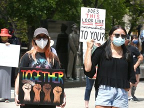 Suporters rally in front of City Hall in downtown Calgary on Saturday, July 11, 2020. A group of anbout 125-150 protested the Alberta government's new critical infrastructure legislation. A similar protest was planned to take place in Edmonton on legislature grounds.