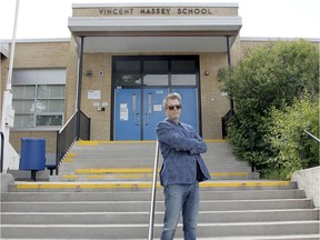 Chad Lefevre poses for a photo outside Vincent Massey School in the SW. The father of two students has sent a letter to Adriana LaGrange, Minister of Education, to reconsider the provinces strategy to open schools this fall. Wednesday, July 22, 2020. Brendan Miller/Postmedia