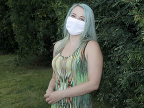 Tamara Burton poses for a photo along Oakfield Dr. SW. Burton says she became ill days after attending a Canada Day party but tested negative for COVID-19. Others who attended the same party tested positive for coronavirus. Thursday, July 23, 2020.