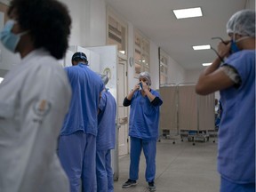 This file photo shows international health professionals using face masks. Locally, while most health care workers do wear their masks when and where required, there are some who ignore that rule.