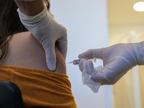 A volunteer receiving a trial COVID-19 vaccine at the Hospital das Clinicas in Sao Paulo state, Brazil, on July 21, 2020.